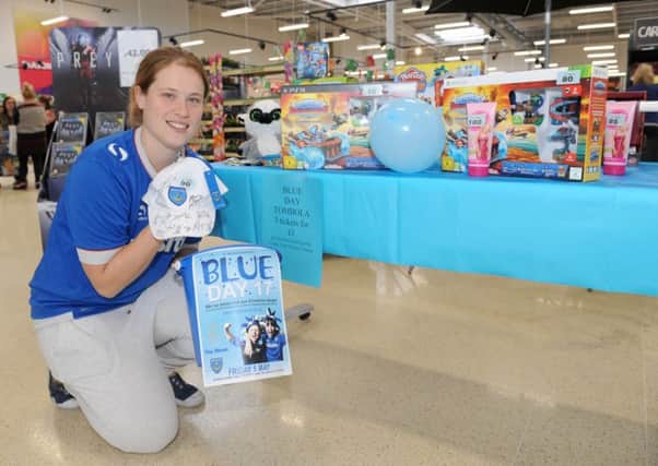 Gemma Morrison, community champion at Tesco Extra in Fratton, with some of the tombola Blue Day prizes last year

Picture: Sarah Standing (170585-7045)