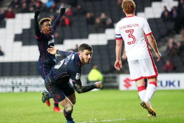 Conor Chaplin sets off on his lung-busting charge after scoring the winner at MK Dons. Picture: Joe Pepler