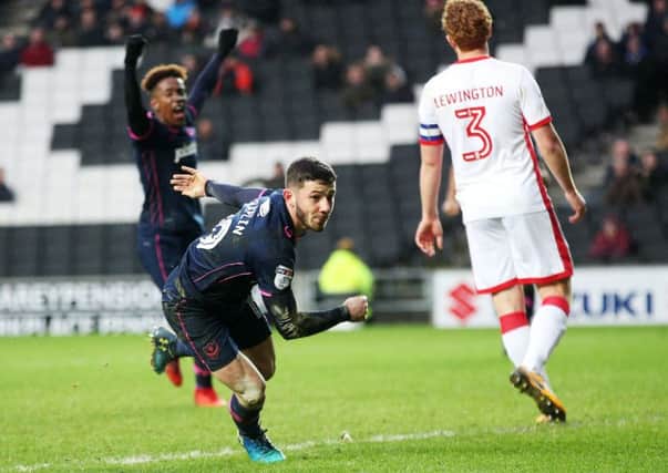 Conor Chaplin sets off on his lung-busting charge after scoring the winner at MK Dons. Picture: Joe Pepler