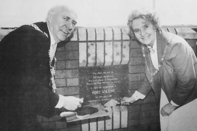 Mr and Mrs Warner are pictured wielding their trowels as they lay the foundation stone at Port Solent