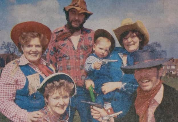 Pistol-packing cowboys and cowgirls with Scott Bacon. From left, Sally Lawton, Sandy Harris, Rory Stevenson, Rosemarie Bacon and Alan Small before the kick off