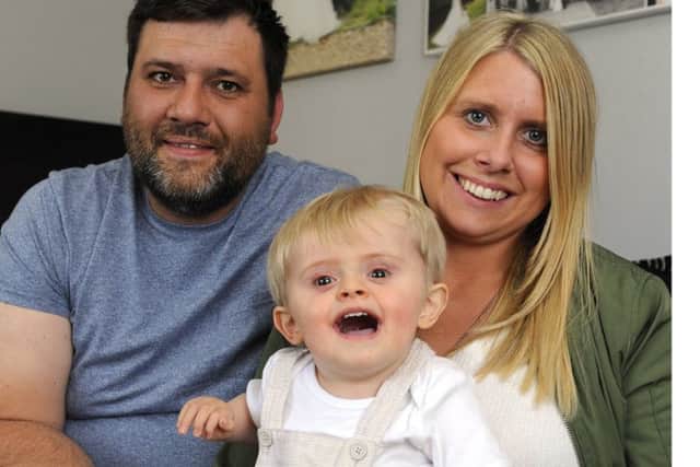 Freddie Mundey with parents Ryan and Jade Mundey.
Picture by Malcolm Wells (180501)