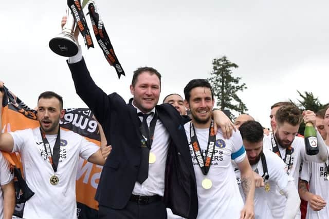 Lee Bradbury and his players celebrate success