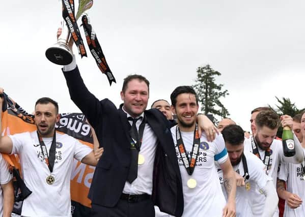 Lee Bradbury and his players celebrate success