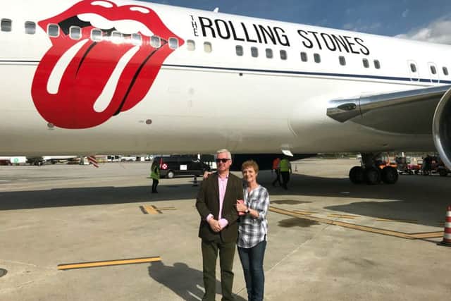 Joyce Smyth with her husband in front of the Rolling Stones' plane