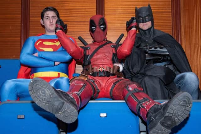 Clash of the titans - Deadpool messes around with Superman and Batman
     Pictures: Vernon Nash (180382 -017)