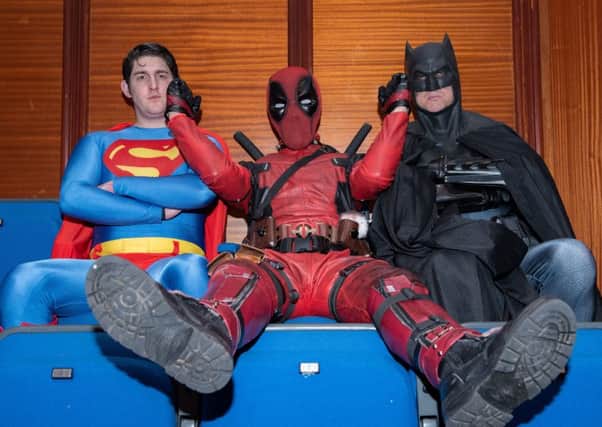 Clash of the titans - Deadpool messes around with Superman and Batman
     Pictures: Vernon Nash (180382 -017)