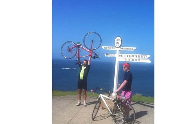Jamie Marriott, left, and Mitchell Jones at Land's End after cycling from John O'Groats four years ago