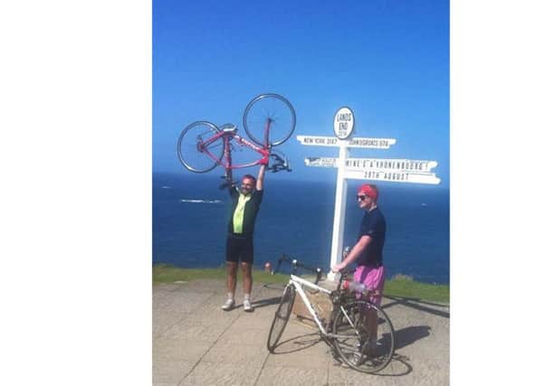 Jamie Marriott, left, and Mitchell Jones at Land's End after cycling from John O'Groats four years ago
