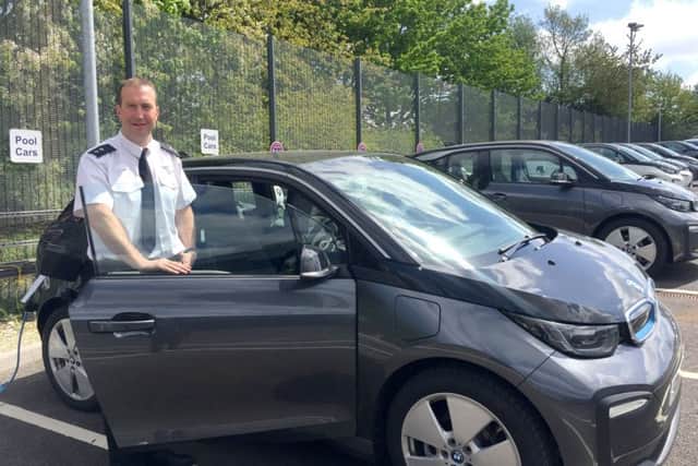Insp Andy Tester with the new electric BMW i3 car fleet for Hampshire police. Picture: Hampshire police

From: 