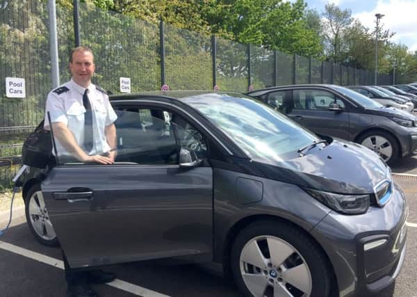 Insp Andy Tester with the new electric BMW i3 car fleet for Hampshire police. Picture: Hampshire police

From: 