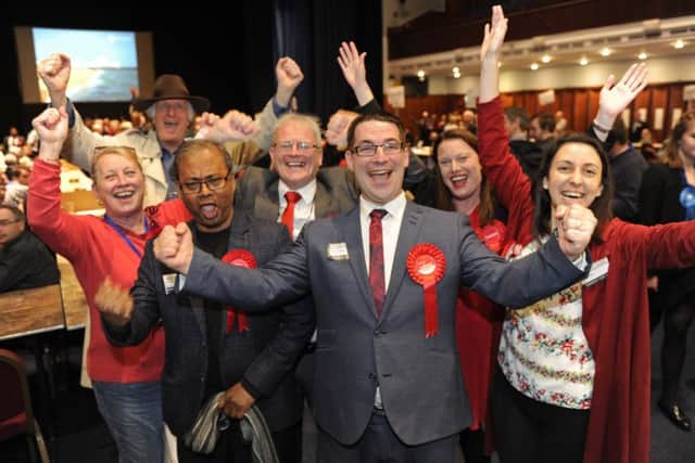 Tom Coles celebrates his success with colleagues.
 Picture Ian Hargreaves  (180470)