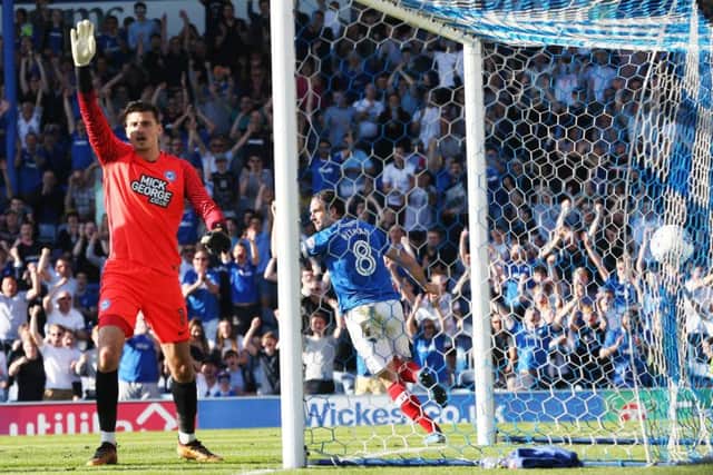 Posh keeper Jonathan Bond appeals for offside as Bret Pitman turns to celebrate his second goal in the 2-0 win over Peterborough Picture: Joe Pepler