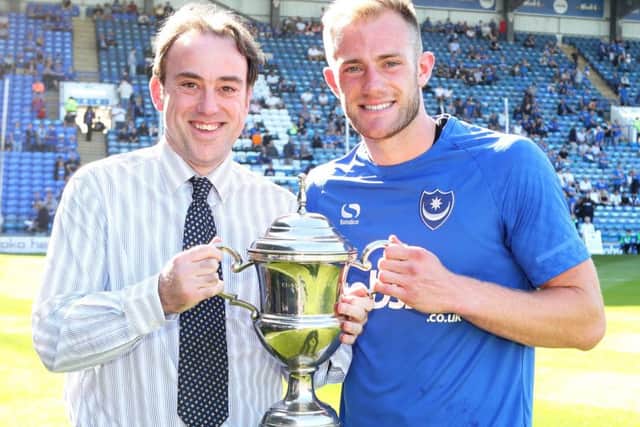 Pompey defender Matt Clarke receives The News/Sports Mail Pompey Player of the Year Trophy from chief sports writer Neil Allen