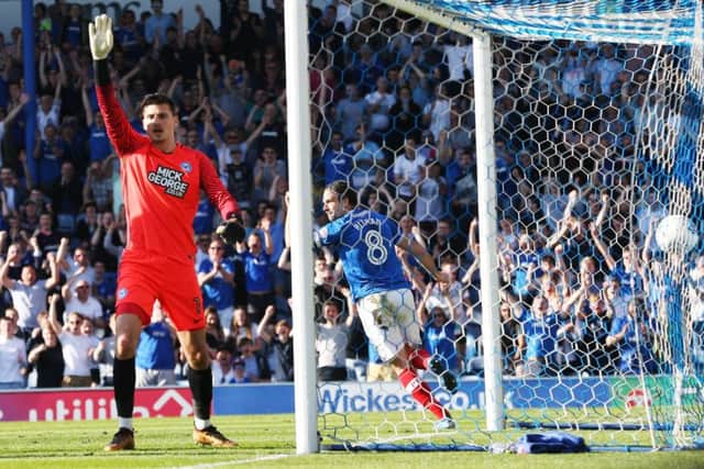 Bett Pitman turns to celebrate his second goal against the Posh