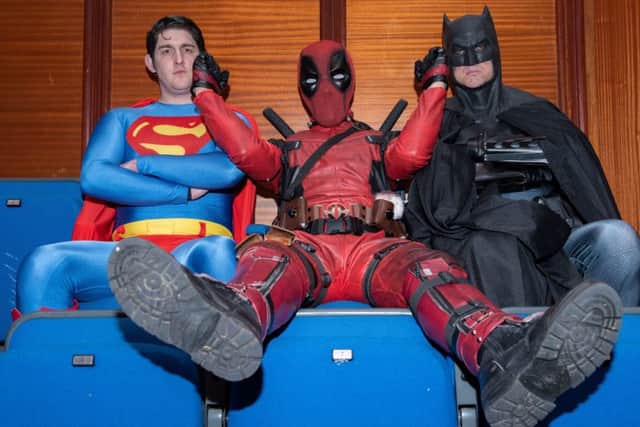 Deadpool messes around with Superman and Batman.
Picture: Vernon Nash (180382 -017) PPP-180605-073819006