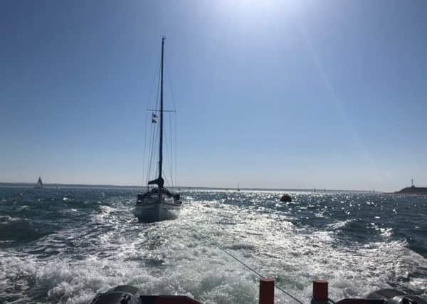 Gafirs tow a yacht with a suspected fire on Sunday. Picture: Gafirs.