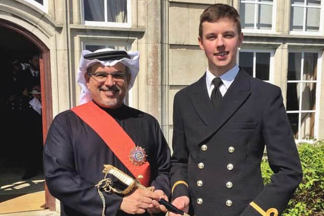 Prince Salman bin Hamad Al Khalifa, crown prince of Bahrain, presenting the Queen's Sword to Sub Lieutenant Tom Hillier, 22, of Gosport, who was named the top officer in training across all the navy's intake in 2017