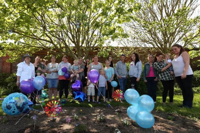 Well-wishers pay tribute to Alfie Evans, on what would have been his second birthday, at the Rainbow Garden they have planted in his memory on Southsea Common              Picture: Chris Moorhouse