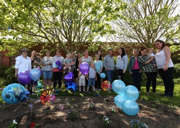 Well-wishers pay tribute to Alfie Evans, on what would have been his second birthday, at the Rainbow Garden they have planted in his memory on Southsea Common              Picture: Chris Moorhouse
