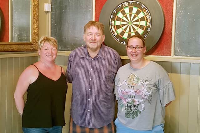 From left: Tina Burrell, her dad Allan Harper with The Stag's landlady Karen Andrews