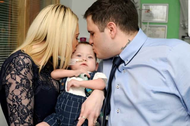 Hannah Bloomfield and Wayne Olivares with son Max Olivares at his christening on March 23, at Southampton General Hospital. Picture: Mark Robbins Photography