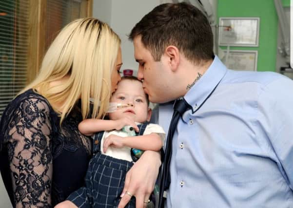 Hannah Bloomfield and Wayne Olivares with son Max Olivares at his christening on March 23, at Southampton General Hospital. Picture: Mark Robbins Photography