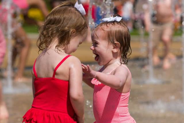 Dahlia and Skla Barter play in the fountains at Southsea Castle.
Picture: Duncan Shepherd