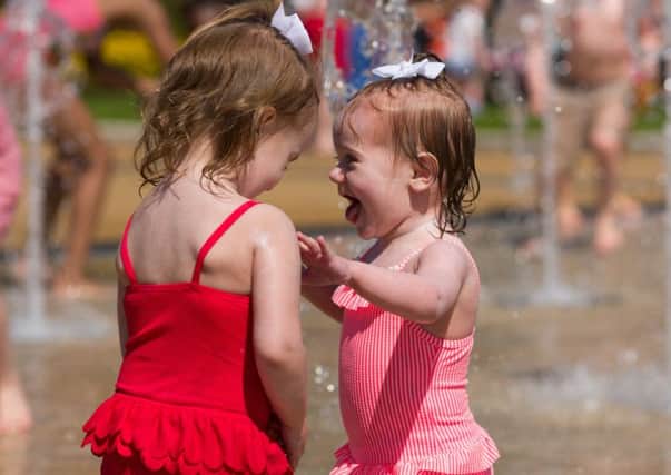 Dahlia and Skla Barter play in the fountains at Southsea Castle.
Picture: Duncan Shepherd