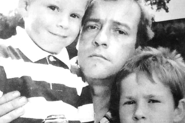 jpns 020618 retroTurtles - Paul Russel, four, and his brother Mark, six, with their father Tony, 36