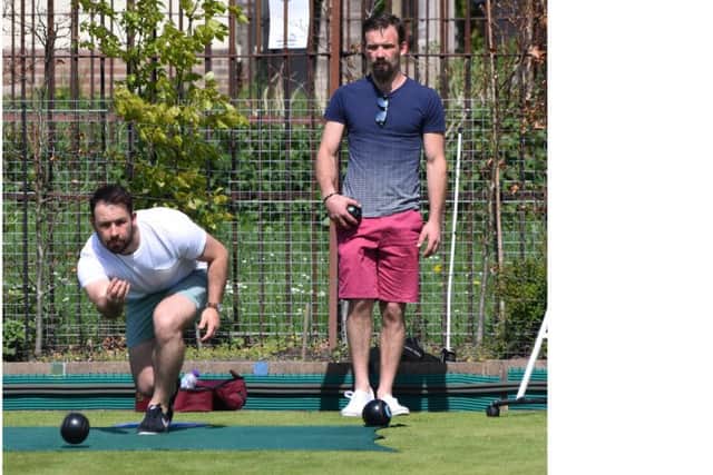 Brothers Sean, left, and Marc Snelling develop their bowling skills