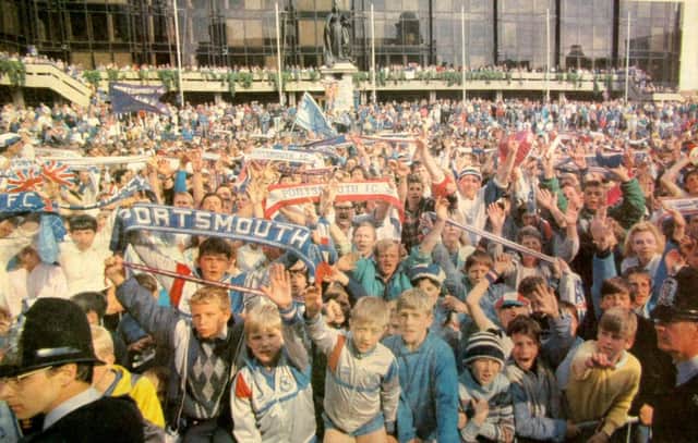 Pompey fans pack the Guildhall Square to give their heroes a colourful welcome