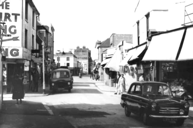 A look along Charlotte Street on Monday, April 24, 1961. Who would have thought that Shirt King (down Meadow Street) was there at that time?