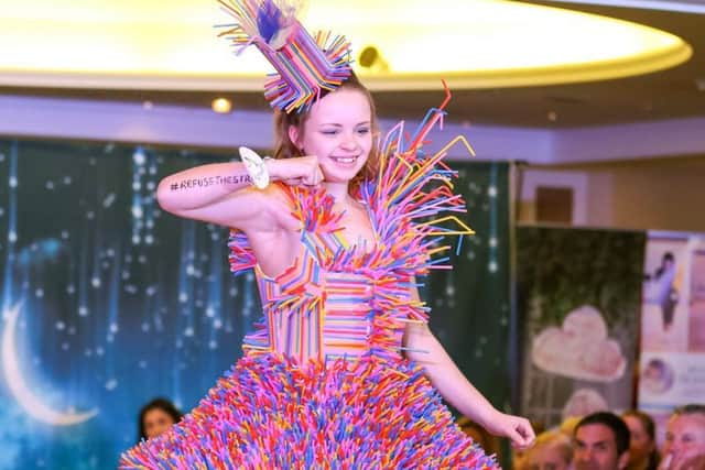 One of the creative dresses made out of straws! at the Walk the Walk event