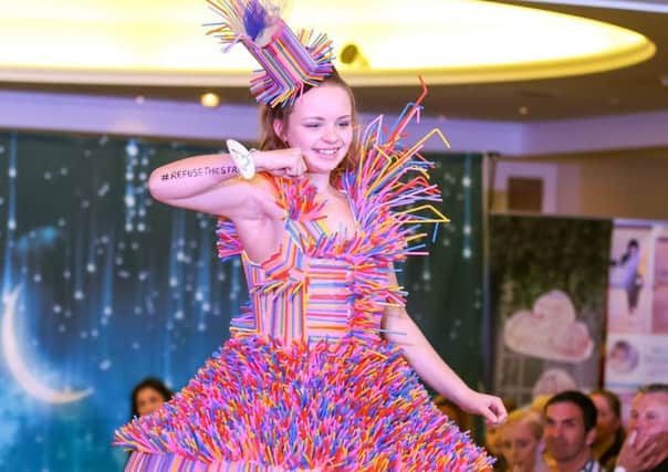 One of the creative dresses made out of straws! at the Walk the Walk event