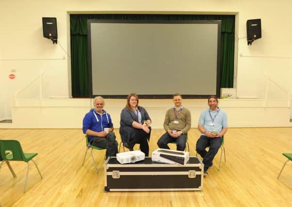 Left to right, Andrew Wiseman, Community Centre Manager Leah Moore, Dan Moore and Kev Conroy set up the new area for the first time 

Picture by: Malcolm Wells (180430-6321)