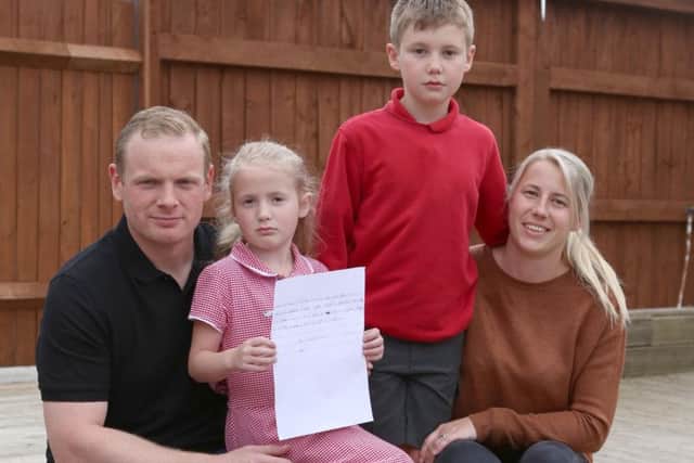 Emma Frank with dad
Mark, brother Oliver and mum Michelle.
Picture : Habibur Rahman PPP-181105-171949006