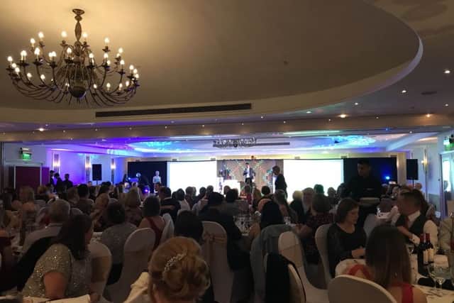 Scores of nurses look on as Paul Thomas gets the awards ceremony under way on Friday