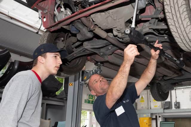 Andy Williams of Apollo group demonstrates to Andrei Mosora from Portsmouth UTC how measurements are taken to determine chassis damage
Picture: Keith Woodland (180290-29)