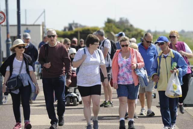 The walkers on the Eastney promenade Picture: Ian Hargreaves (180476-7)
