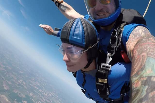 Charlotte SkydiveCharlotte in the air at the start of her 15,000 foot skydive, with the instructor from Go Skydive. PPP-180514-172504001