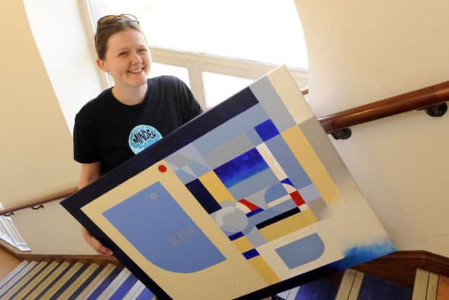 Finance manager for MINDER Alice Rowe carries work titled 'I'm Coming Home Baby' by Dave Allen