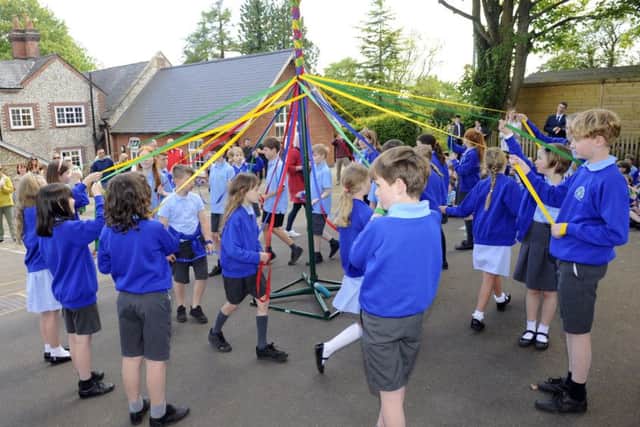 Children at Hambledon Primary School celebrated the arrival of Spring this week in true May Day style. Picture by:  Malcolm Wells (180510-8094)