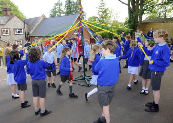 Children at Hambledon Primary School celebrated the arrival of Spring this week in true May Day style. Picture by:  Malcolm Wells (180510-8094)