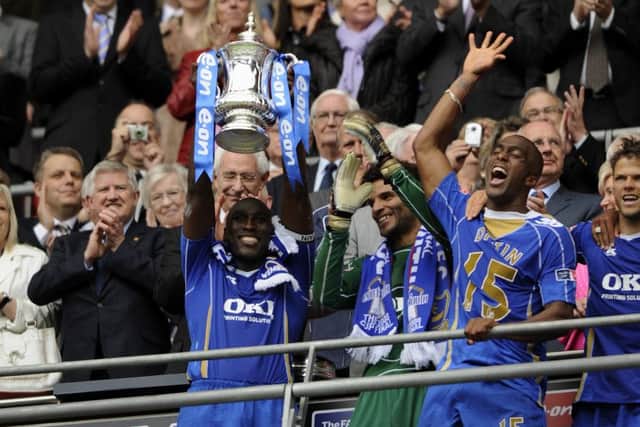 Sylvain Distin with his shirt reversed for the trophy presentation