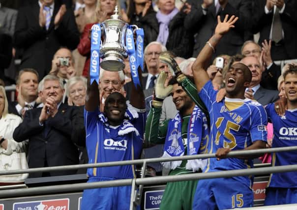 Sylvain Distin with his shirt reversed for the trophy presentation