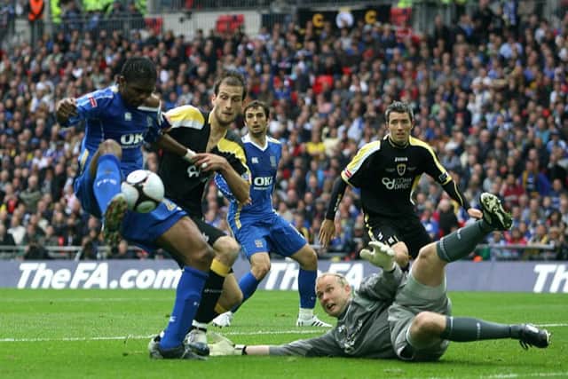Kanu nets Pompey's winner in the FA Cup final against Cardiff.