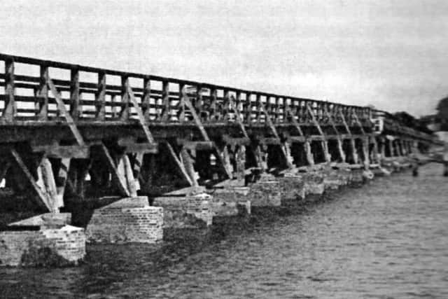 jpns 160518 rw

The former wooden trestle bridge across Langstone Harbour.
The wooden trestle bridge  across Langstone Harbour. The swing bridge can just be seen.
Picture: Ralph Cousins collection.