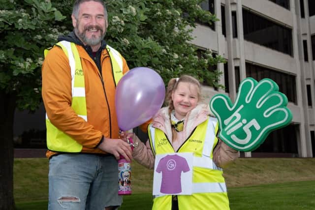 Ellie Jeffrey celebrates her 25th parkrun as a volunteer with her dad Paul Jeffrey. Picture: Vernon Nash (180383-0009)