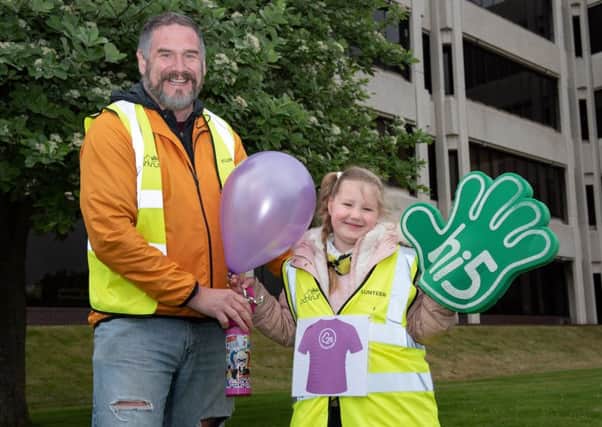 Ellie Jeffrey celebrates her 25th parkrun as a volunteer with her dad Paul Jeffrey. Picture: Vernon Nash (180383-0009)